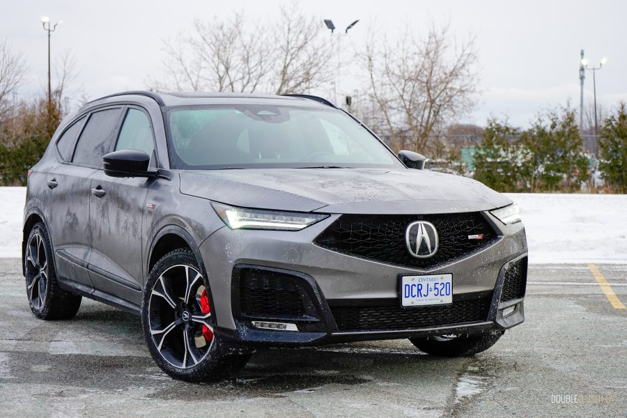 Front quarter view of a grey 2025 Acura MDX Type S Ultra on a cloudy and snowy day