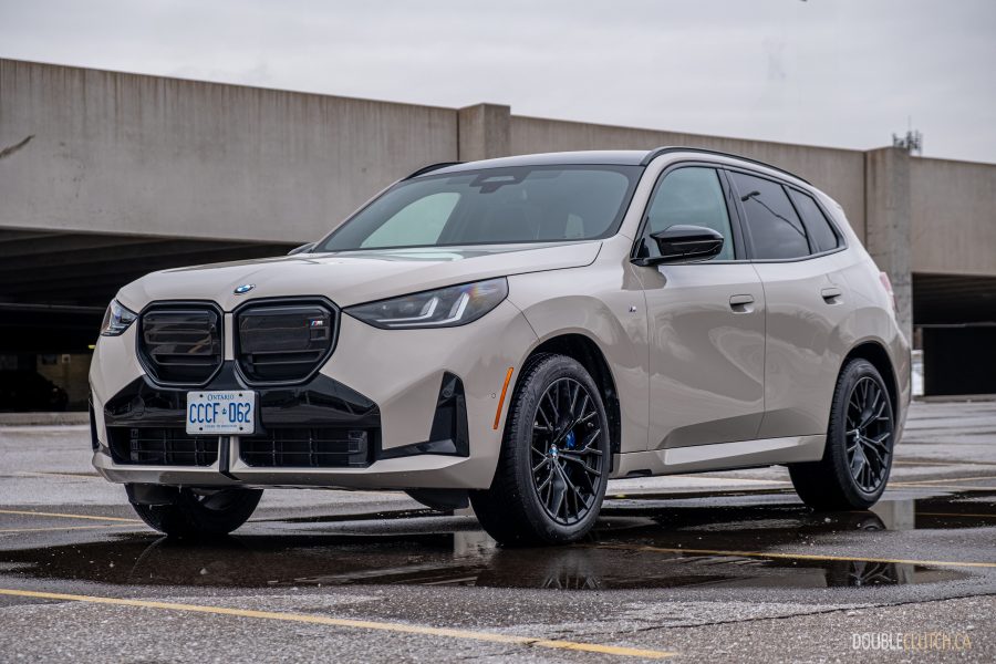 Front quarter view of the 2025 BMW X3 M50 on a cloudy day